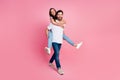 Full body photo of nice young couple hold piggyback happy dating wear trendy white clothes isolated on pink color