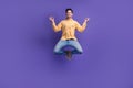 Full body photo of nice young male jump meditate levitate closed eyes wear trendy yellow outfit isolated on violet color