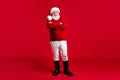 Full body photo of old man in santa claus headwear cross hands enjoy jolly holly magic miracle event wear jumper Royalty Free Stock Photo