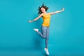 Full body photo overjoyed lady good mood jump high up rejoicing wear casual clothes isolated blue color background
