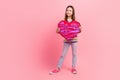 Full body photo picture small young age person girl brown hair hold her favorite candies surprise heart isolated on pink