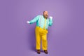 Full body photo of positive cheerful fat man enjoy dancing on discotheque wear turquoise shirt trousers white gloves Royalty Free Stock Photo