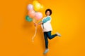 Full body photo positive emotions afro american girl hipster jump hold baloons anniversary wear white stylish trendy