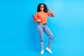 Full body photo of young afro woman happy positive smile show thumb-up fine safeguard fire fighter isolated over blue Royalty Free Stock Photo