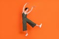 Full body photo of young attractive girl happy positive smile dancer ballerina isolated over orange color background