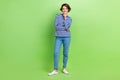 Full body photo of young attractive woman bob brown hair touch chin thoughtful posing wear new clothes isolated on green Royalty Free Stock Photo