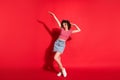 Full body photo of young attractive woman have fun dance enjoy hands up isolated over red color background Royalty Free Stock Photo