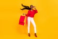 Full body photo of young cheerful girl shopping mall store discount eyeglasses isolated over yellow color background Royalty Free Stock Photo