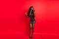 Full body photo of young excited black girl sing song microphone concert celebrity isolated over red color background