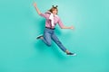 Full body photo of young excited girl happy positive smile jump up wave hello tight jumper isolated over turquoise color Royalty Free Stock Photo