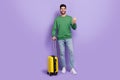 Full body photo of young latin arab guy hold device flight airport check in wear stylish green clothes isolated on