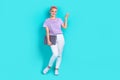 Full body photo of young pink dyed hair girl hold laptop indicate finger mockup user modern device isolated on Royalty Free Stock Photo