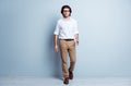 Full body photo of young serious handsome man confident go walk meeting wear formalwear isolated over grey color Royalty Free Stock Photo