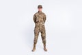 Full body photo of young woman confident soldier officer army camouflage uniform isolated over white color background Royalty Free Stock Photo