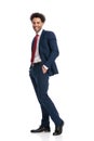 Full body picture of happy young businessman posing with hands in pockets Royalty Free Stock Photo