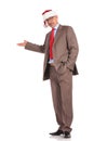 Full body picture of an old santa claus businessman presenting Royalty Free Stock Photo