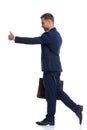 full body picture of unshaved businessman making thumbs up sign Royalty Free Stock Photo