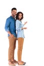 Full body picture of young casual couple presenting Royalty Free Stock Photo