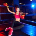 Full body portrait of boxer woman sitting in ring corner Royalty Free Stock Photo