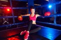 Full body portrait of boxer woman sitting in ring corner Royalty Free Stock Photo