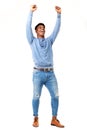 Full body cheerful young black man with arms raised against isolated white background Royalty Free Stock Photo