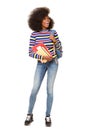 Full body happy african american female student against isolated white background with books and bag Royalty Free Stock Photo