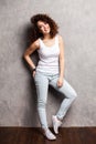 Full body portrait of happy smiling beautiful young woman, isolated over gray background. Royalty Free Stock Photo