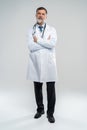 Full body portrait of happy smiling doctor, isolated on white background. Royalty Free Stock Photo