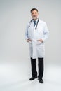 Full body portrait of happy smiling doctor, isolated on white background. Royalty Free Stock Photo