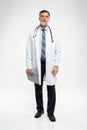 Full body portrait of happy smiling doctor, isolated on white background. Royalty Free Stock Photo