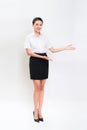 Full body portrait of happy smiling young beautiful business woman showing something or copyspase Royalty Free Stock Photo