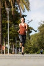 Healthy young woman running outdoors Royalty Free Stock Photo