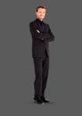 Full body portrait of man standing with grey background Royalty Free Stock Photo