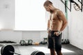 Pretty man tired after weightlifting at gym Royalty Free Stock Photo