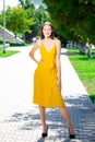 Full body portrait of a young beautiful woman in yellow dress Royalty Free Stock Photo