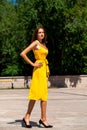 Full body portrait of a young beautiful woman in yellow dress Royalty Free Stock Photo