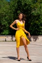 Full body portrait of a young beautiful woman in yellow dress Royalty Free Stock Photo