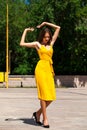 Full body portrait of a young beautiful woman in yellow dress Royalty Free Stock Photo