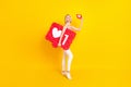 Full body profile photo of funny blogger blond hair lady hold likes wear top pants isolated on yellow background