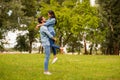 Full body profile photo of overjoyed pair spending best date in green park wear casual denim outfit