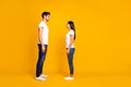 Full body profile photo of pair lady and guy looking eyes wait who begin conversation wear casual outfit isolated yellow