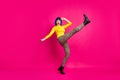 Full body profile photo of terrified lady raise leg up falling down slippery road wear retro specs yellow turtleneck