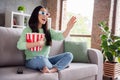 Full body profile side photo of surprised positive asian girl watch 3d film impressed modern effect hold pop corn box