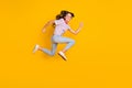 Full body profile side photo of young excited girl happy smile jump up run hurry sale isolated over yellow color