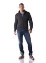 Full body shot of attractive young man with wool sweater and jeans Royalty Free Stock Photo