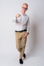 Full body shot of happy young blonde businessman pointing at camera Royalty Free Stock Photo