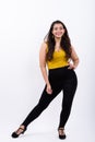 Full body shot of young happy Indian woman smiling while posing Royalty Free Stock Photo