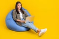 Full body size photo of successful korean business lady use laptop for her company accountant isolated on bright yellow