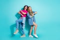 Full body size photo of two young teenagers chilling dancing boogie woogie couple in hippie clothing isolated on cyan