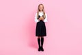Full body size photo of young cute schoolkid girl hold new gadget for studying elearning excited positive isolated on